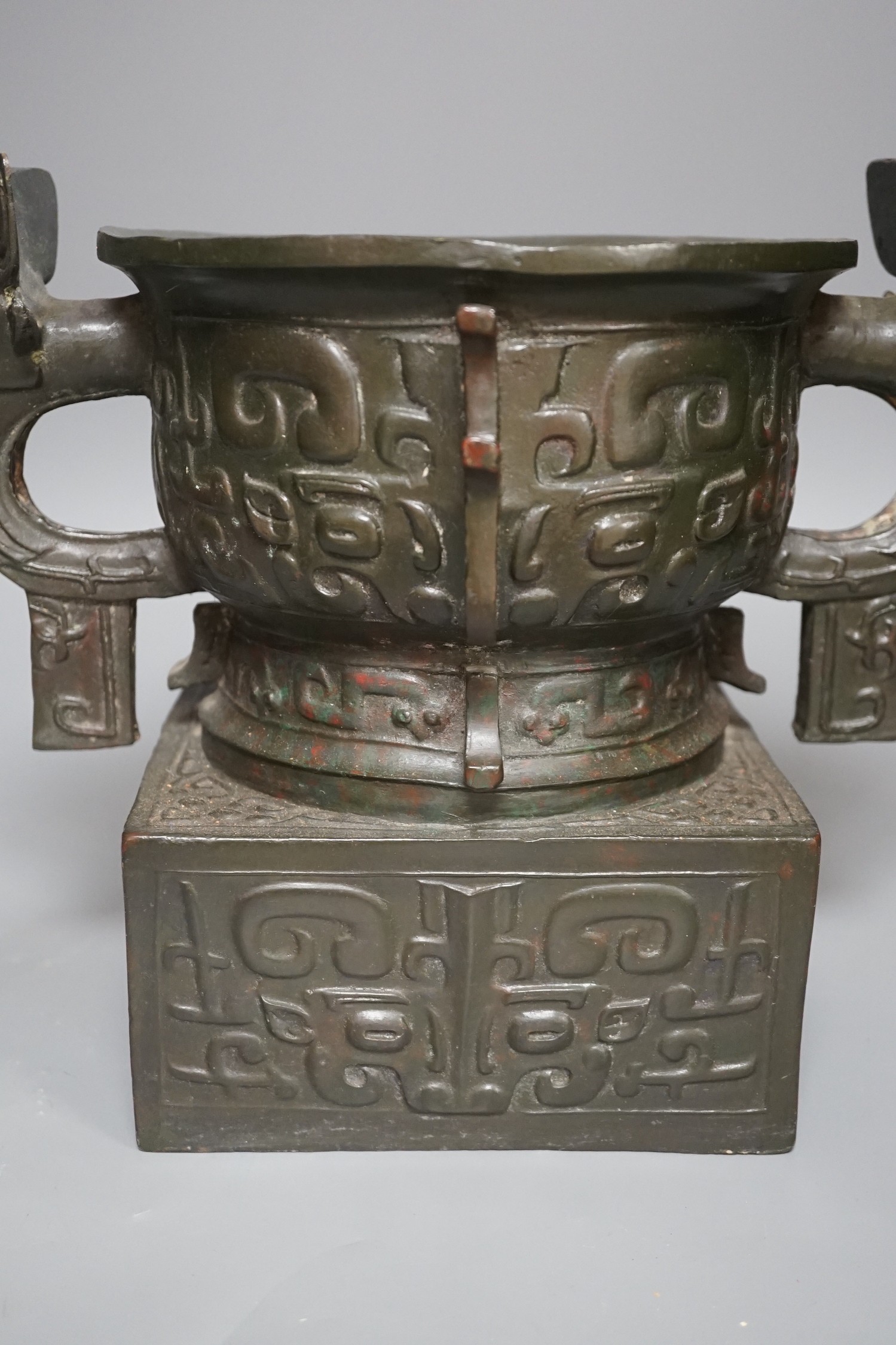 An archaistic Chinese bronze vase after the antique, modelled as an original bronze in the collection of the Palace Museum, Beijing, boxed with certificate, cast number 35. 25.5cm tall